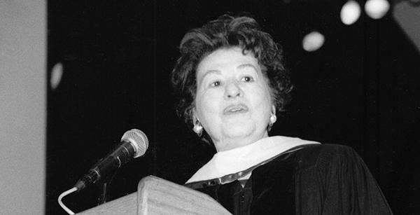 woman at graduation lectern